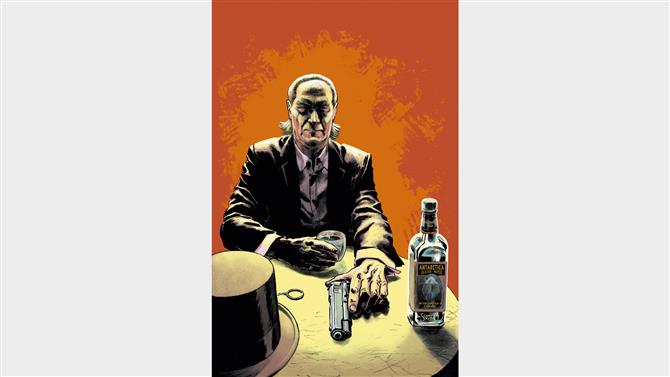 "テーブルの上の銃と酒のボトル。"