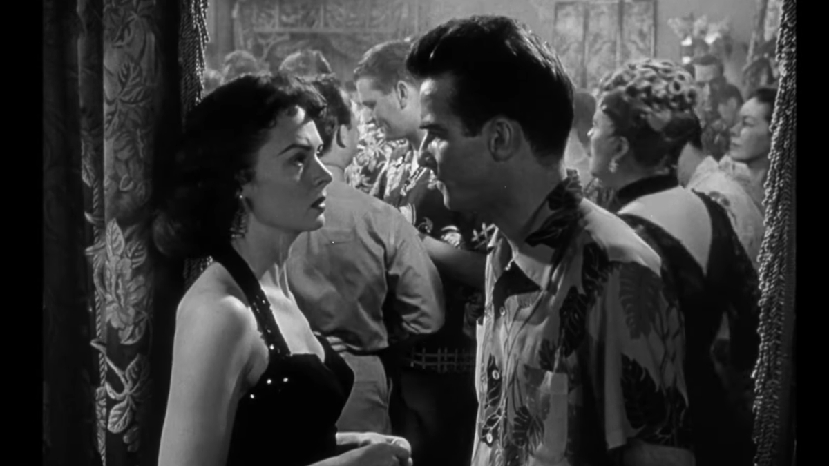 Montgomery Clift en Donna Reed praten in een overvolle bar in From Here to Eternity