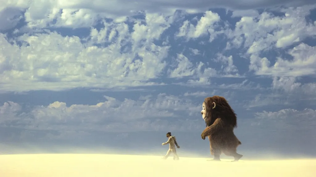 Egy fiú egy vadállattal sétál a sivatagban a Where the Wild Things Are című filmben.